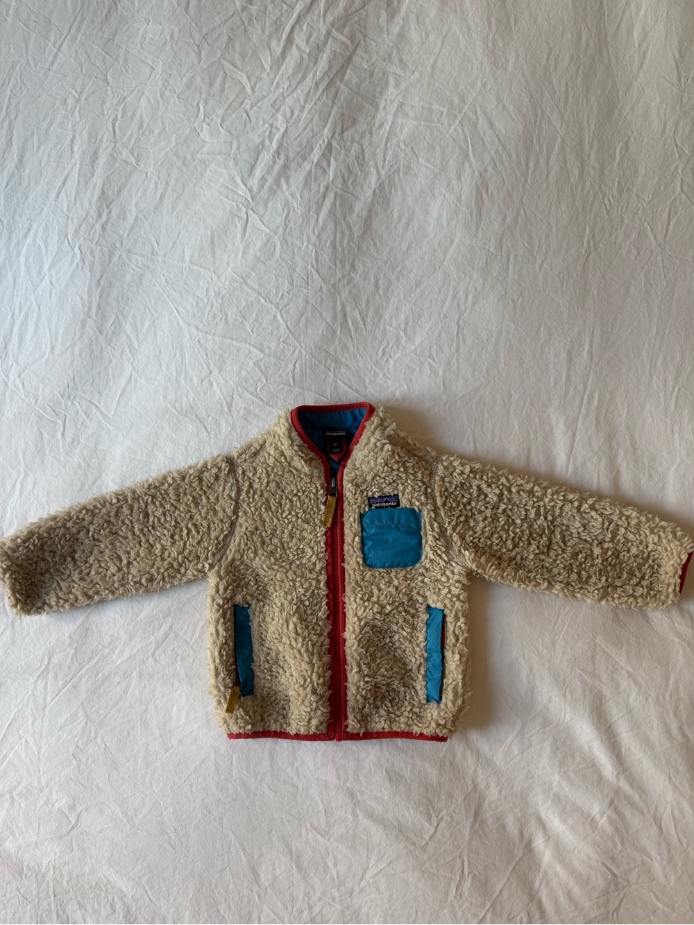 Patagonia Kids Cream Sherpa Jacket with Blue Pockets and Red Trim